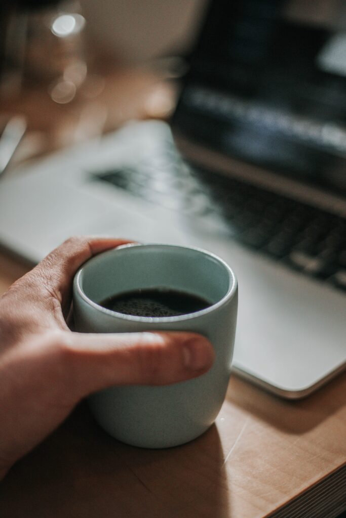 Warm Coffee Moment: Cozy Wallpaper with Relaxed Laptop Vibes
