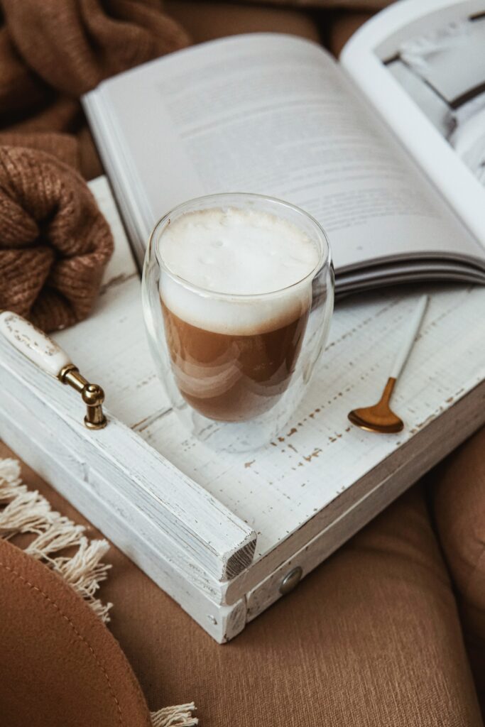 Cozy Coffee Scene: Mug, Book, and Textures on White Tray Wallpaper