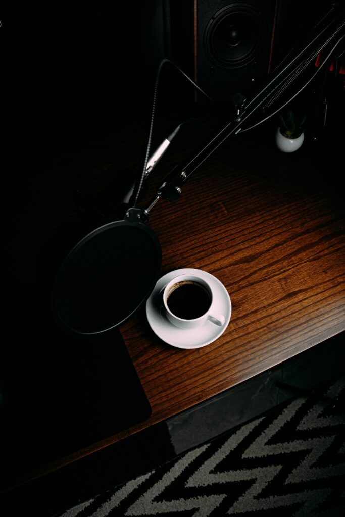 Cozy Workspace with Coffee and Microphone - Perfect Relaxation Wallpaper