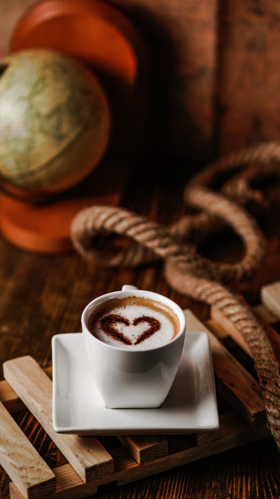 Cozy Coffee Cup Wallpaper: Rustic Charm with Heart Design