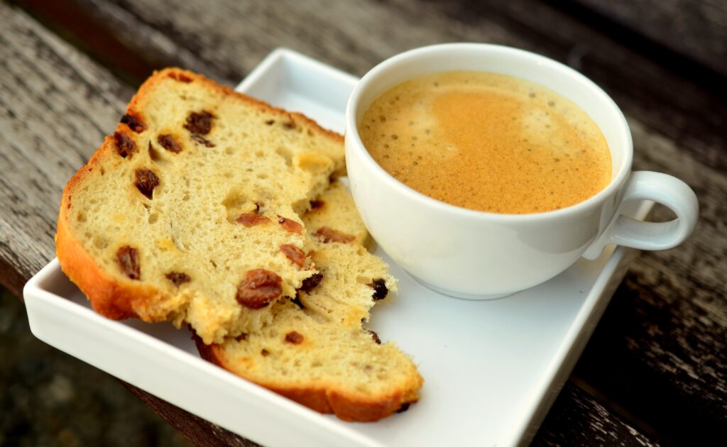 Cozy Wallpaper: Coffee & Raisin Cake on Rustic Wooden Table