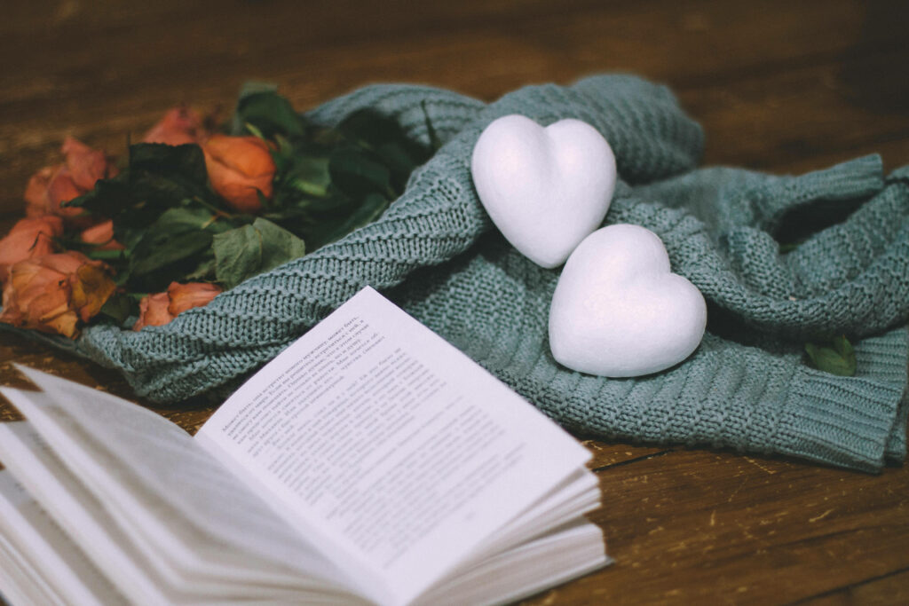 Serene Desktop Wallpaper: Cozy Book, Sweater & Orange Roses