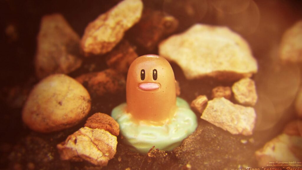 Diglett half buried in soil with warm lighting cartoon style wallpaper background earth tones