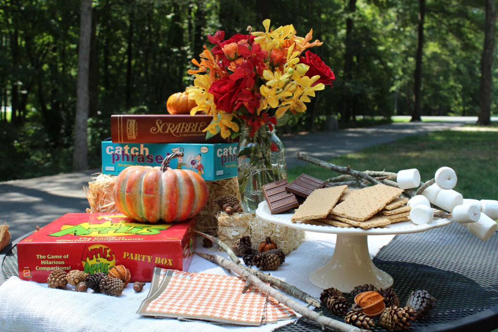 Cozy Fall Birthday Setup with Treats & Games in Autumn Decor Wallpaper