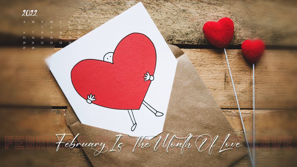 February 2022 calendar wallpaper with stick figure hugging red heart from brown envelope on wood