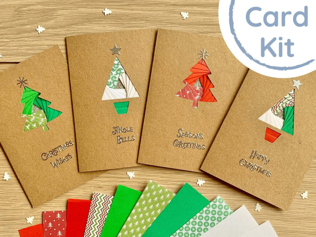 Festive Handmade Christmas Card Kit with Vibrant Paper-Cut Designs Wallpaper