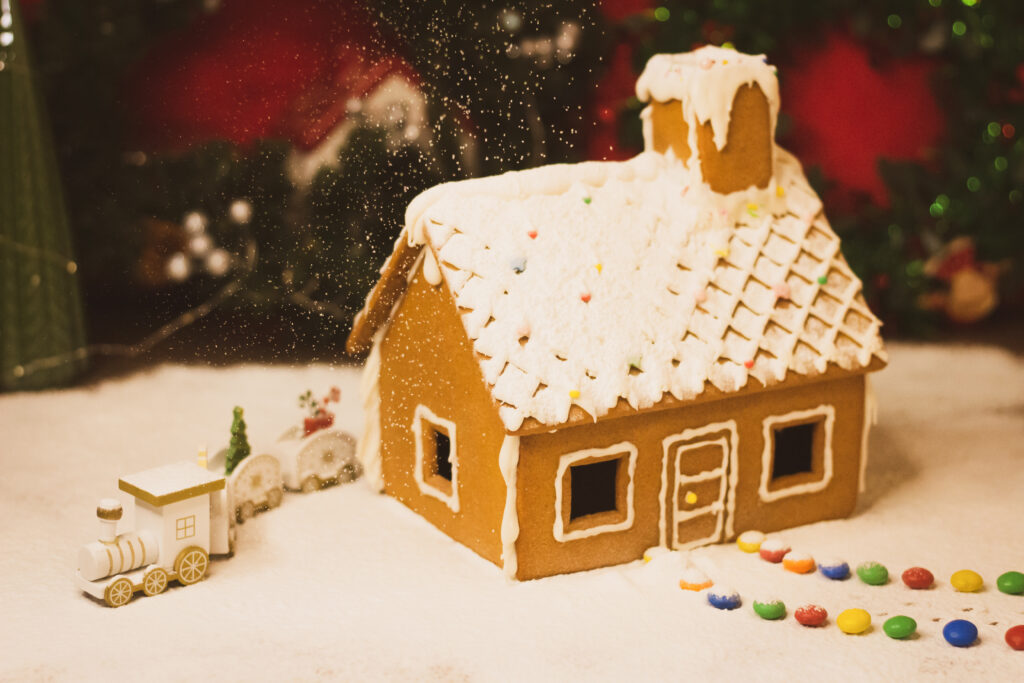 Festive Gingerbread House Sprinkled with Sugar | Cozy Holiday Wallpaper