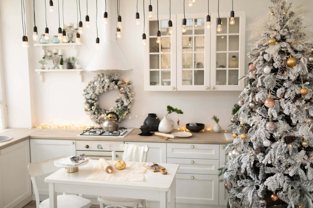 Cozy Festive Kitchen with White Christmas Tree & Cheerful Decor Wallpaper