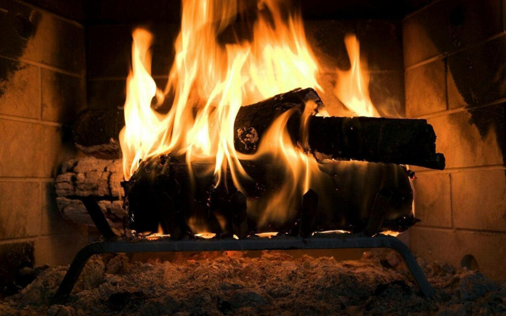 Cozy Fireplace Wallpaper: Warm Ambiance with Vibrant Flames