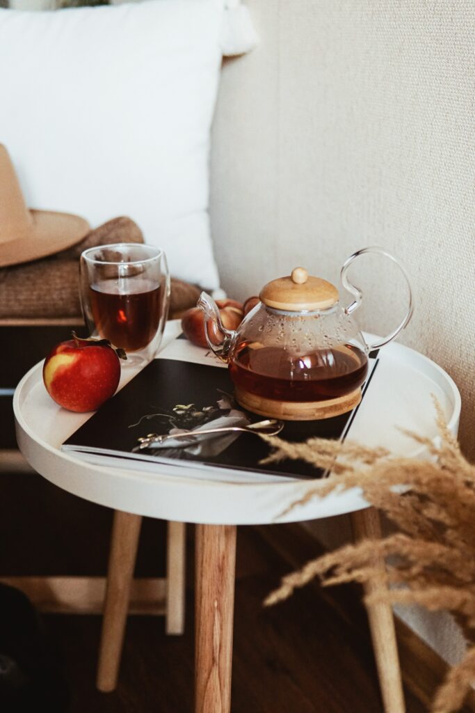 Serene Glass Teapot and Apple Setup for Cozy Wallpaper Background