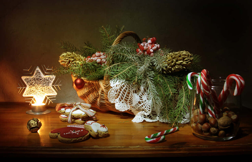 Cozy Holiday Food Table: Candy Canes, Cookies, and Warm Lights Wallpaper