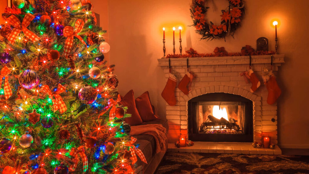Cozy Christmas Room with Colorful Tree and Festive Fireplace Wallpaper
