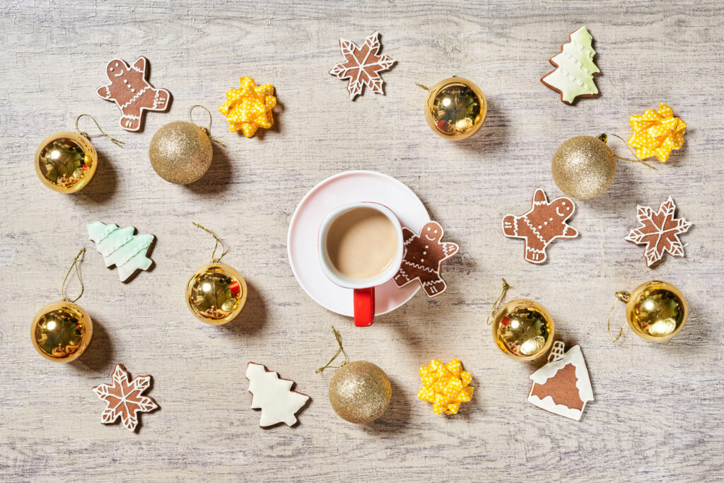 Cozy Holiday Wallpaper: Coffee Cup & Festive Gingerbread Decor