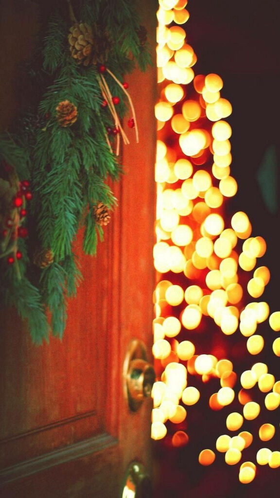 Cozy Holiday Wallpaper: Warm String Lights & Lush Greenery Background