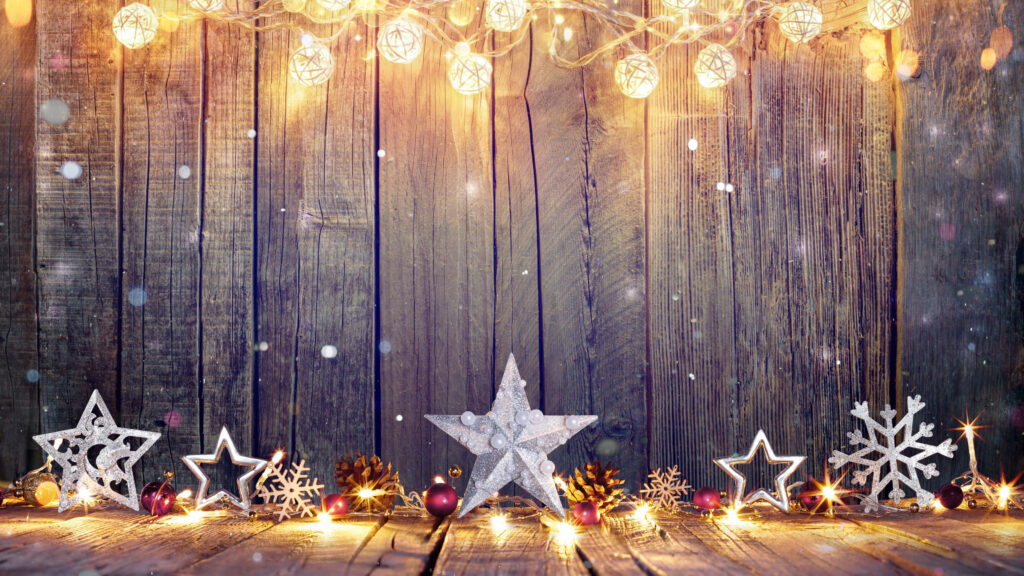 Cozy Rustic Wooden Background with Twinkling Lights & Star Decorations Wallpaper