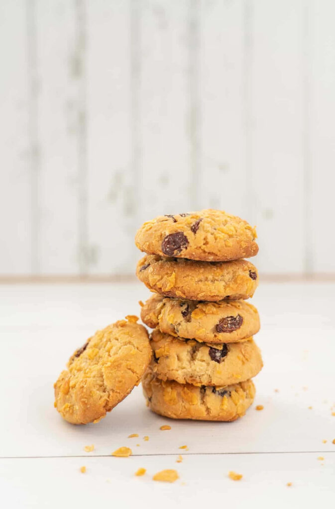 Stack of chunky raisin nut cookies on rustic white wooden background cozy homemade texture Wallpaper