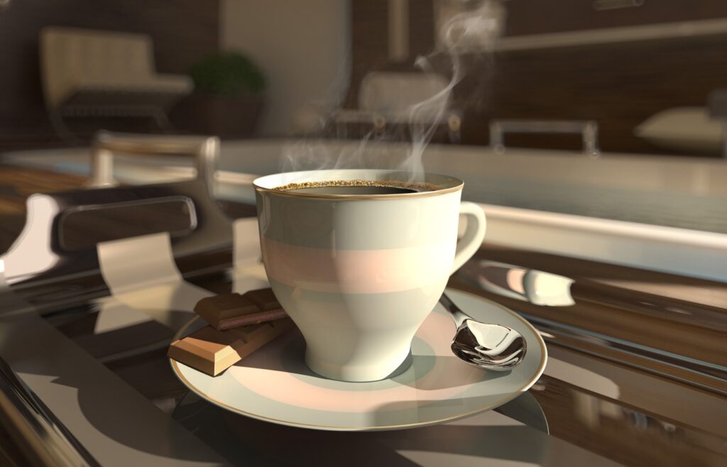 Cozy Coffee Scene: White Cup & Chocolate on Metallic Kitchen Surface Wallpaper