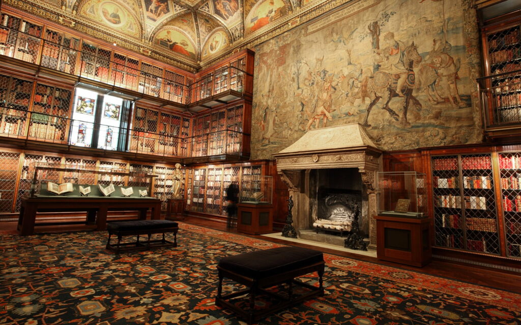 Cozy Reading Haven: A Library Oasis with a Fireplace and Plush Chair in an HD Wallpaper Background Photo