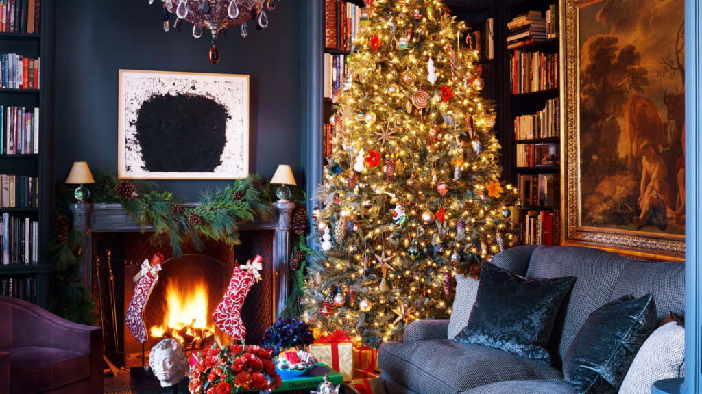 Cozy Christmas Living Room with Tree, Fireplace & Festive Decor Wallpaper