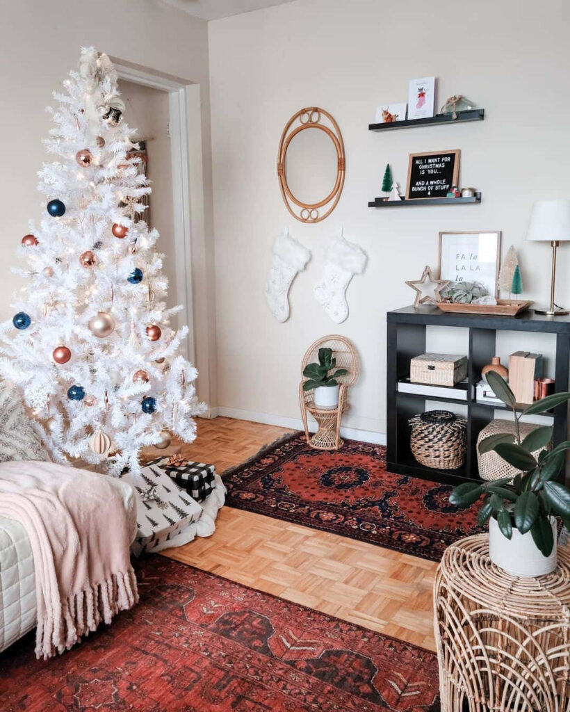 Cozy Living Room with Festive White Christmas Tree & Stylish Decor Wallpaper