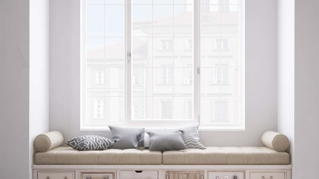 Cozy minimalist window seat Zoom background with beige cushions and grey throw pillows Wallpaper