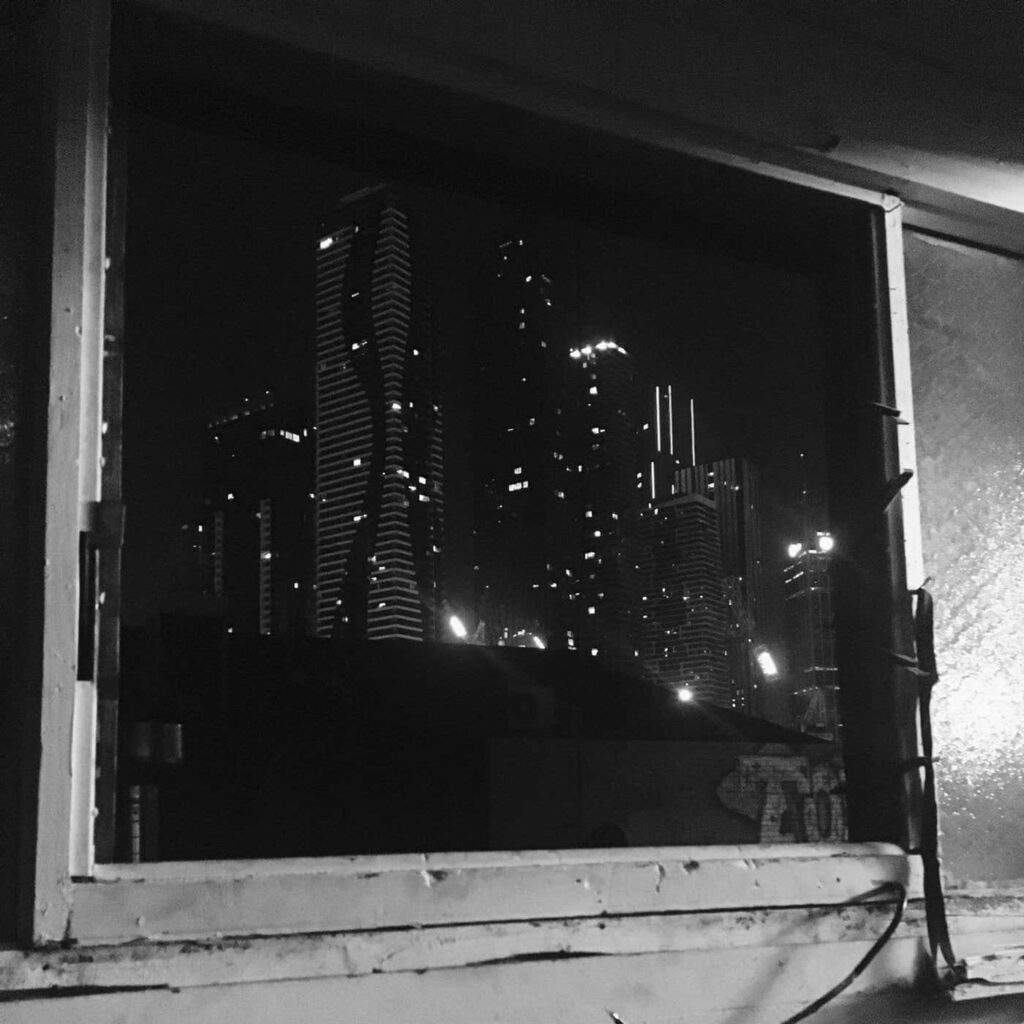Monochromatic Cityscape Wallpaper: Cozy Urban View at Night