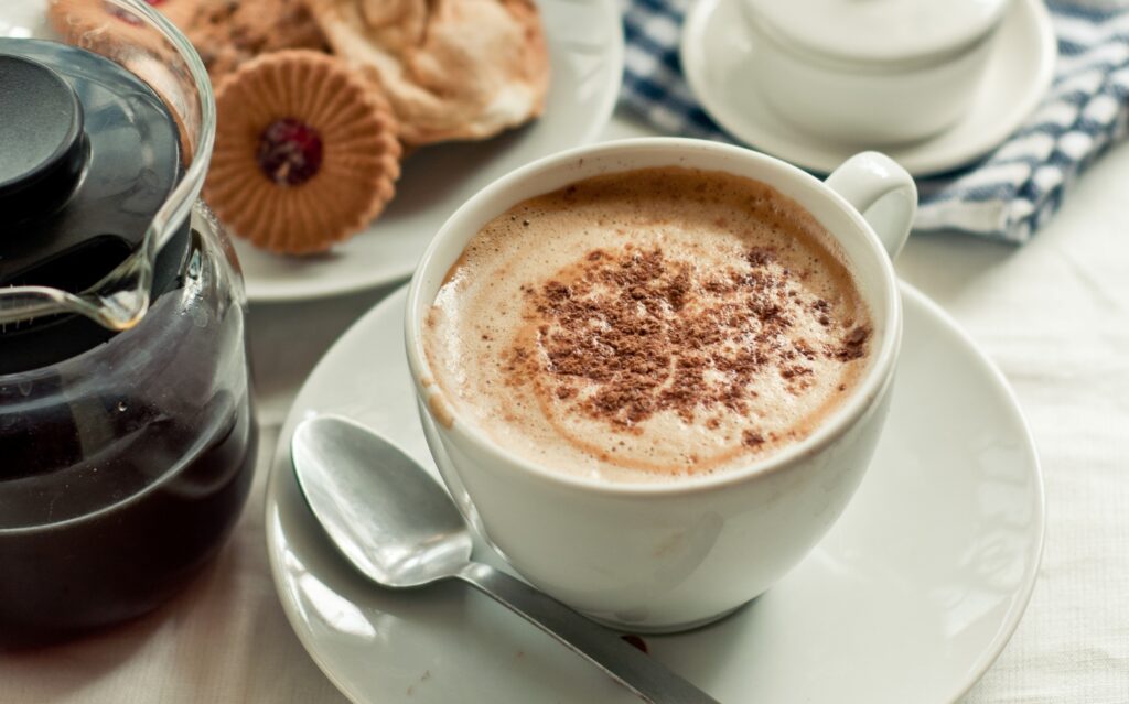 Cozy Morning Coffee & Cookies: Inviting Cinnamon Wallpaper Background