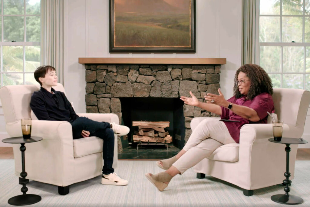 Cozy Wallpaper: Oprah & Eliot Page in Warm Living Room Chat