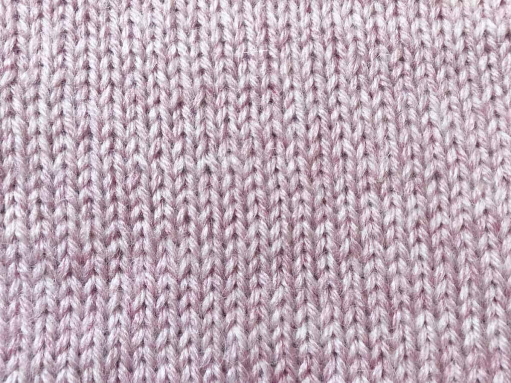 Cozy Pink Knitted Wool Texture Close-Up for Wallpaper Background