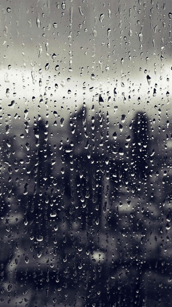 Serene Rainy Day Window Wallpaper for a Cozy iPhone Background