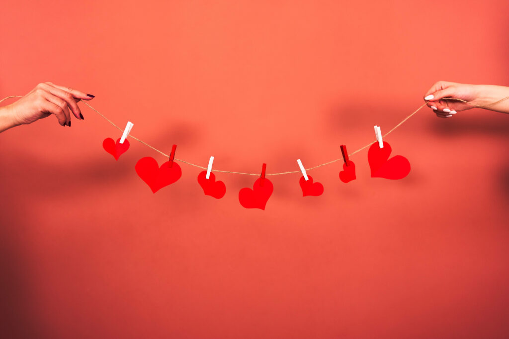 Cozy Red Heart Wallpaper: Romantic String Design on Warm Background
