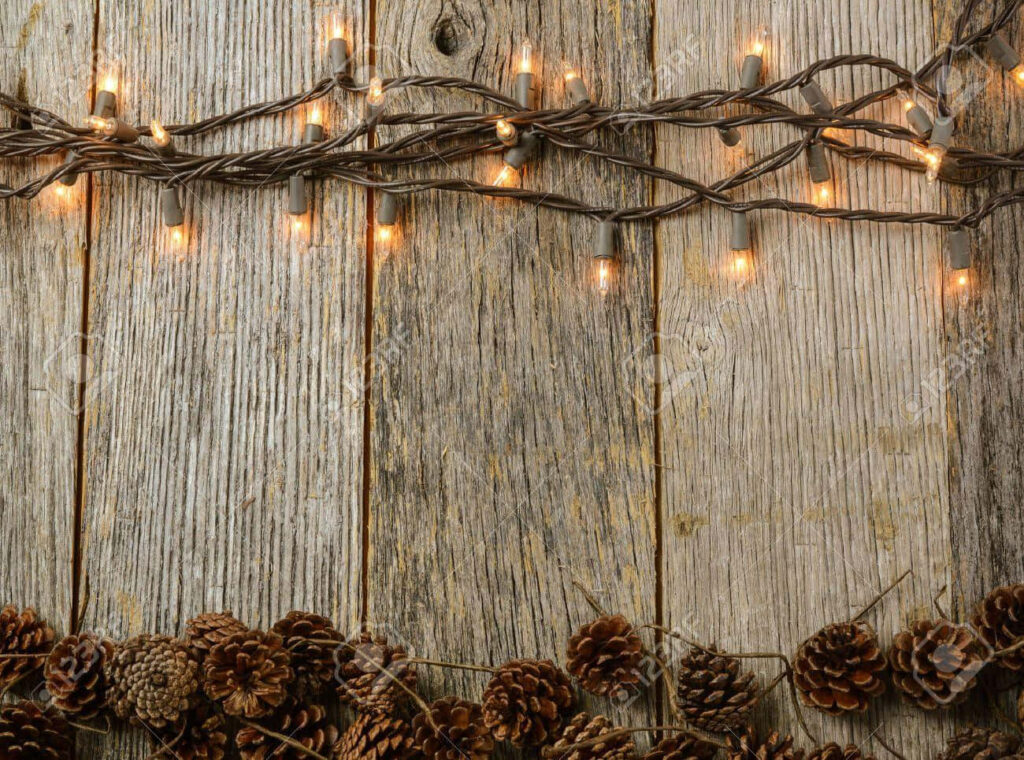 Cozy Rustic Christmas Wallpaper: Pinecones & String Lights Background