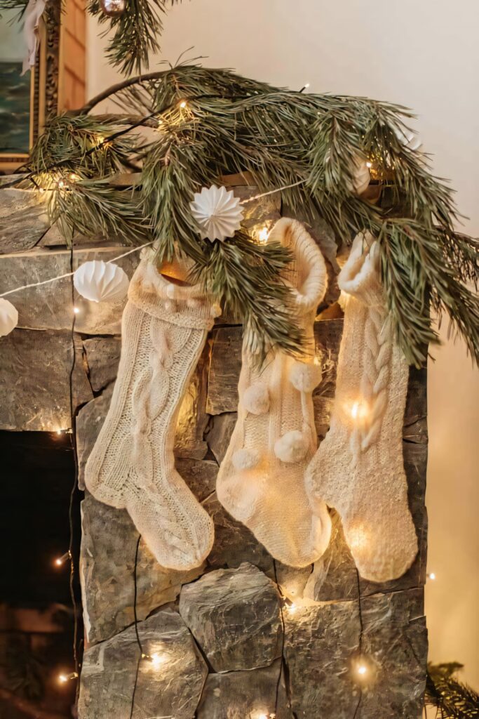 Cozy Rustic Fireplace Wallpaper with Christmas Stockings & Lights