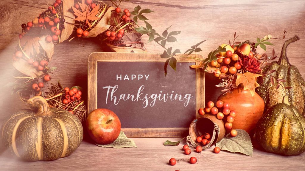 Cozy Thanksgiving wallpaper with chalkboard greeting autumn bouquet pumpkins and warm lighting