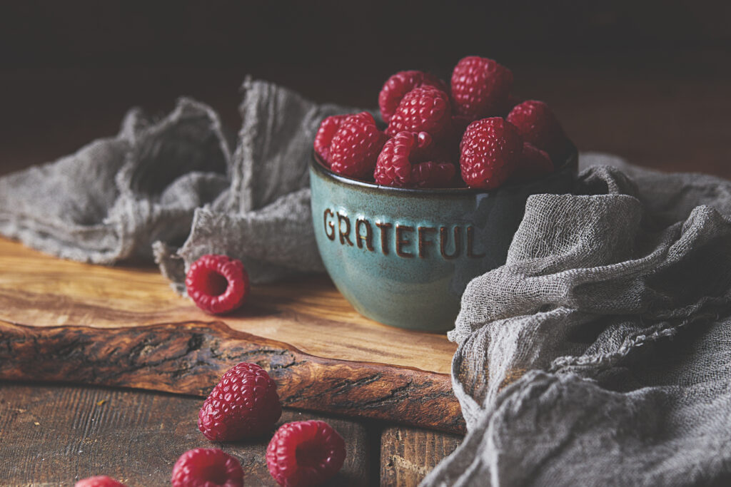 Cozy Raspberry Wallpaper: Rustic Bowl on Textured Surface