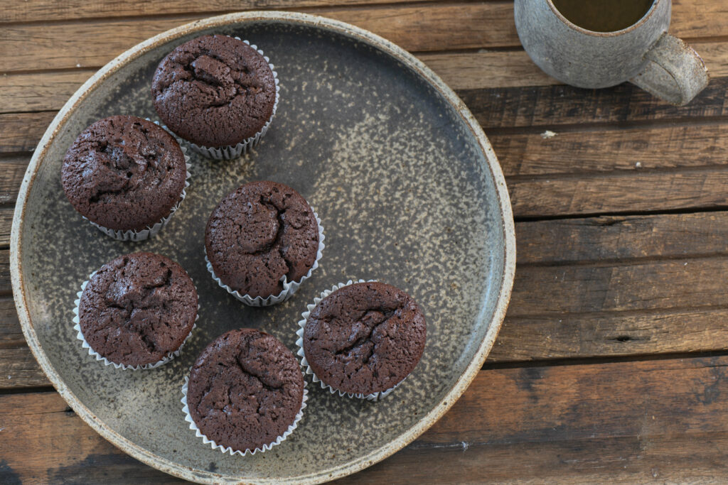 Cozy Rustic Wallpaper: Homemade Chocolate Muffins & Ceramic Mug Scene