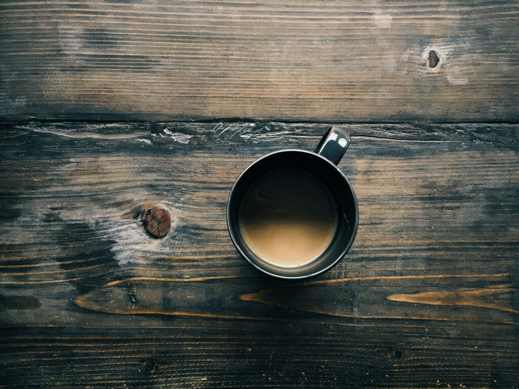 Cozy Rustic Wallpaper: Coffee Mug on Wooden Table Background