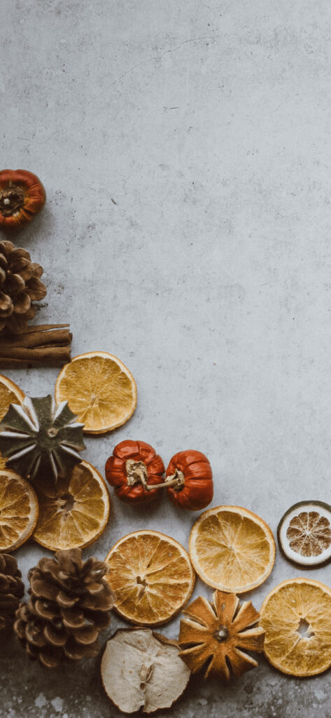 Cozy Rustic iPhone Wallpaper with Dried Fruits & Festive Decor