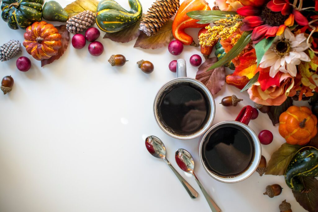 Cozy Still-Life Wallpaper: Coffee, Autumn Decor, and Silver Spoons