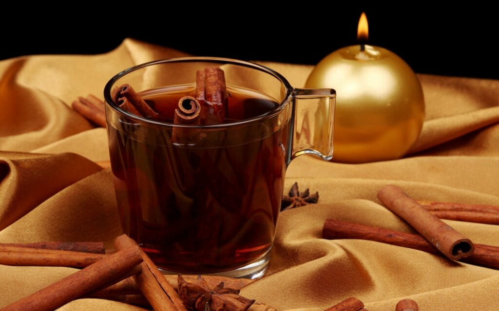 Warm Tea & Cinnamon on Golden Cloth - Cozy Wallpaper Background