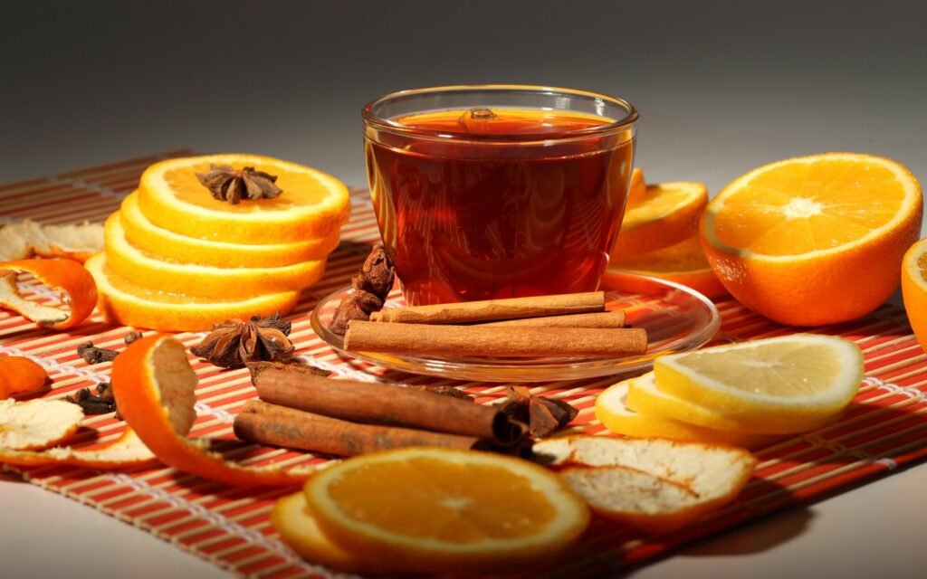 Cozy Tea Composition with Oranges & Spices: Aromatic Wallpaper