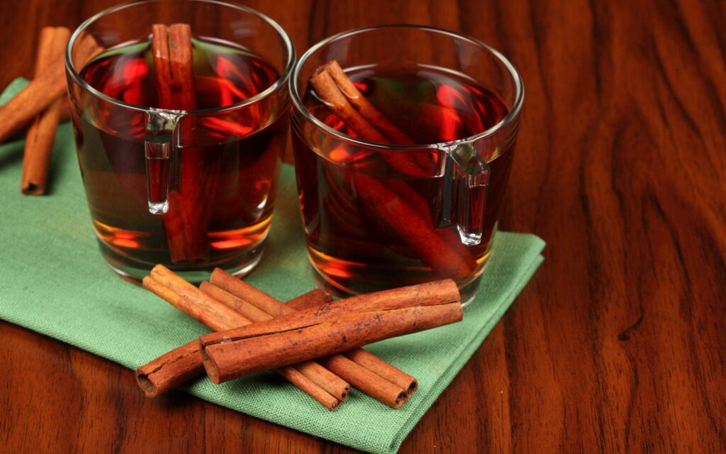 Cozy Tea Wallpaper: Transparent Glasses & Cinnamon on Green Cloth