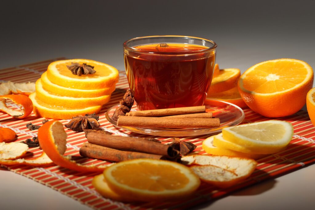 Cozy Tea Wallpaper: Warm Cup with Citrus & Cinnamon Accents