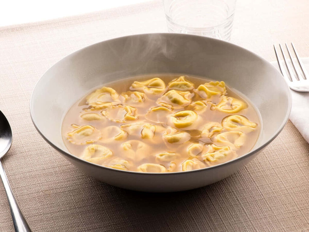 Cozy Tortellini In Brodo Wallpaper: Savory Pasta in Flavorful Broth