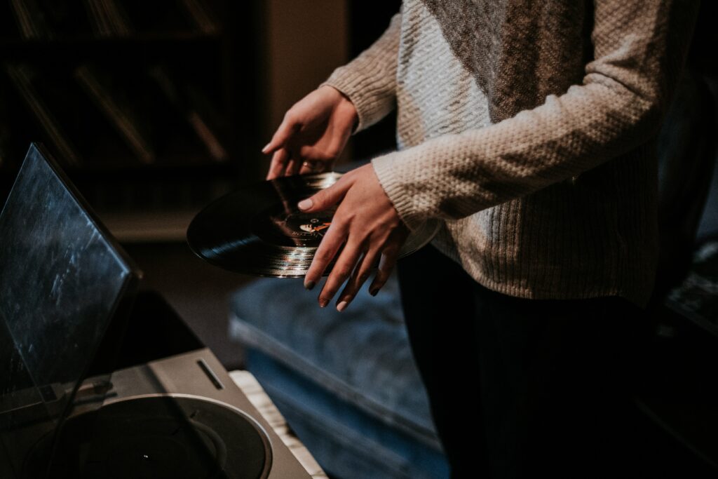 Cozy Vinyl Record Scene: Warm Sweater & Vintage Turntable Wallpaper