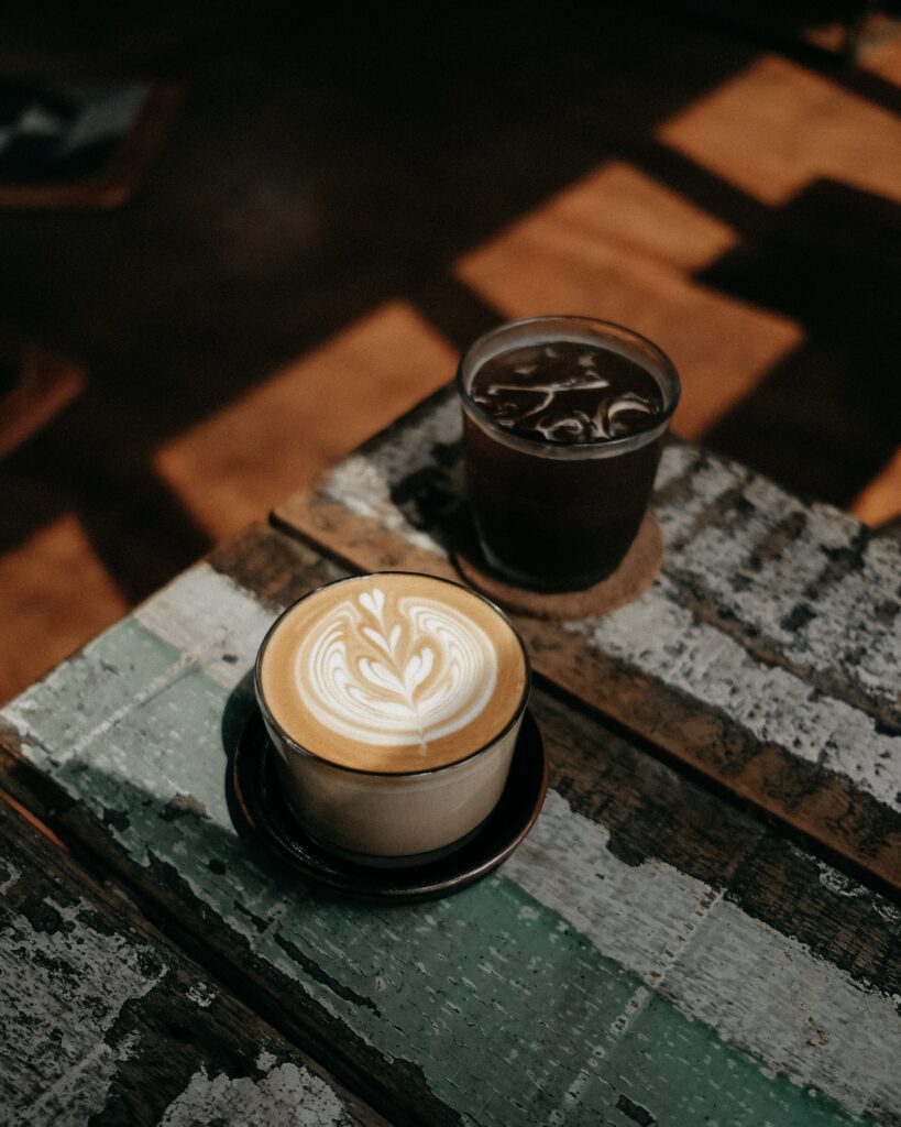 Cozy Wallpaper: Cappuccino & Iced Coffee on Rustic Table