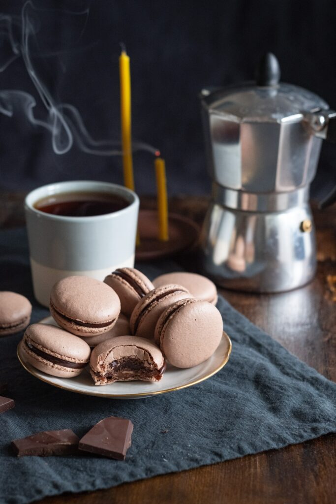 Cozy Wallpaper: Chocolate Macarons & Tea on Rustic Surface