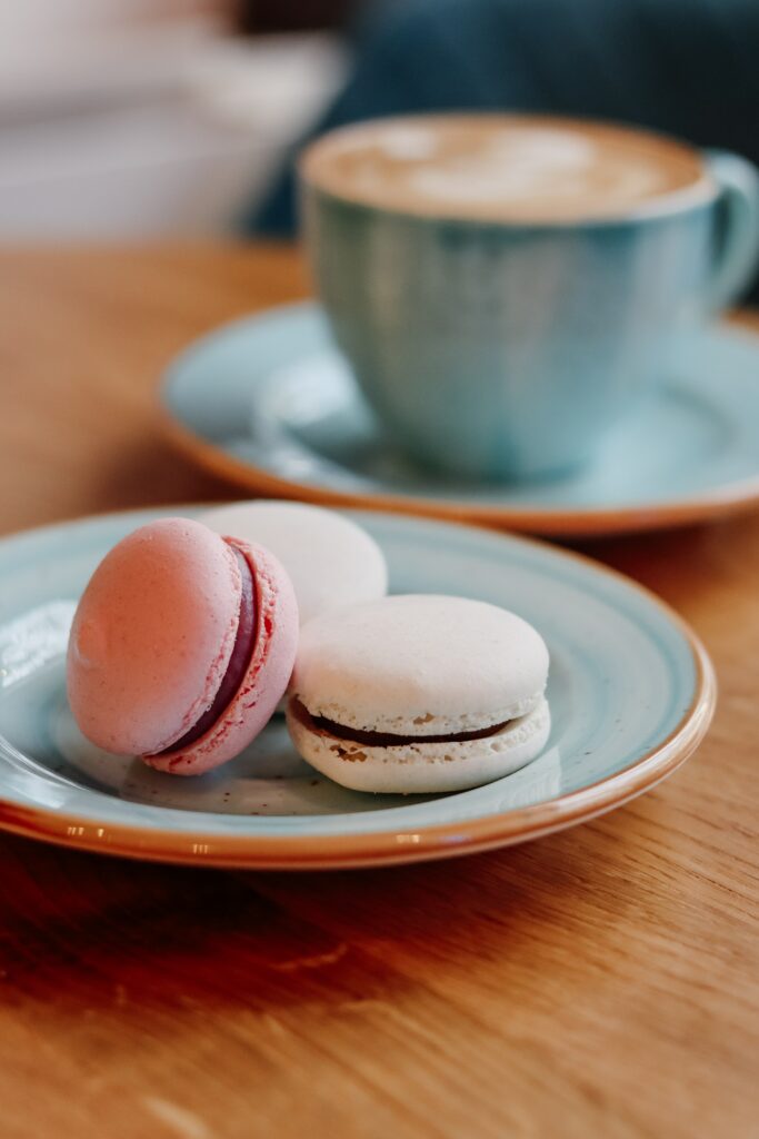 Cozy Wallpaper: Colorful Macarons & Steaming Coffee for Perfect Bliss