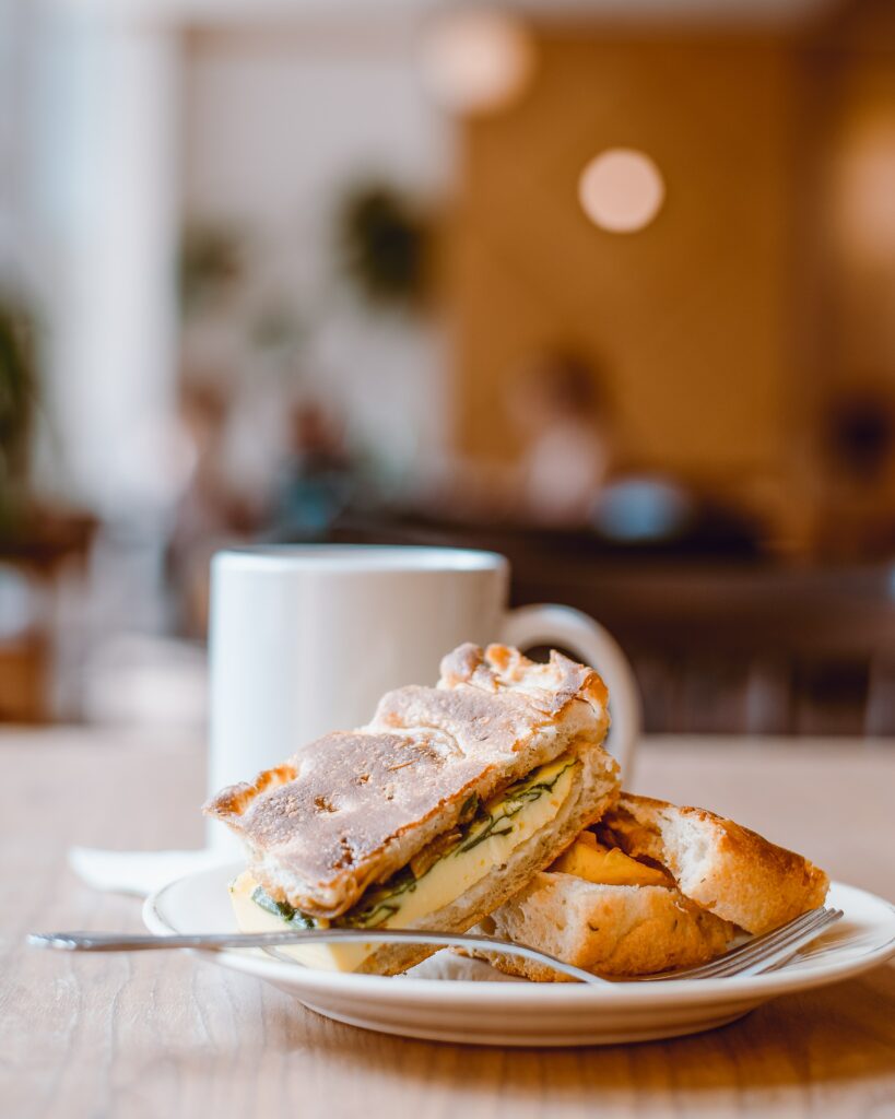 Cozy Pastry Scene: Savory Flaky Treats & Warm Atmosphere Wallpaper