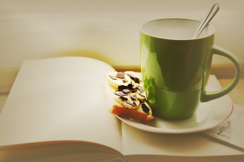Cozy Wallpaper: Green Cup, Chocolate-Dusted Sandwich & Open Book